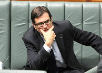 Climate Change Minister Greg Combet listens during House of Representatives question time at Parliament House Canberra, Wednesday, June 5, 2013. (AAP Image/Alan Porritt) NO ARCHIVING