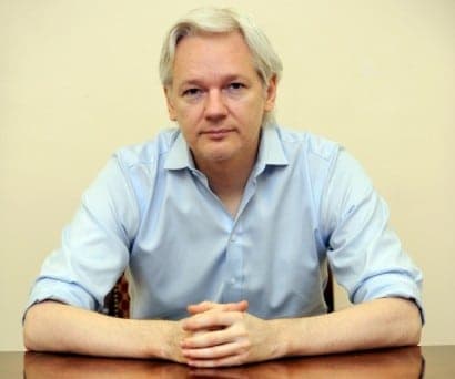 Julian Assange speaks to the media inside the Ecuadorian Embassy in London ahead of the first anniversary of his arrival there on 19th June, 2012. PRESS ASSOCIATION Photo. Picture date: Friday June 14, 2013. WikiLeaks
