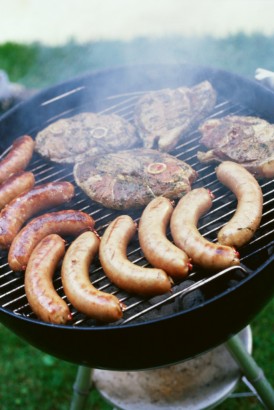 Grilled meat on barbecue grill --- Image by © Royalty-Free/Corbis