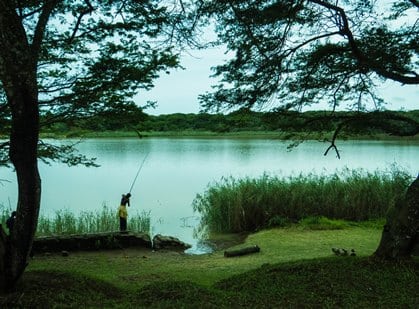 A young local boy fishing in St Lucia