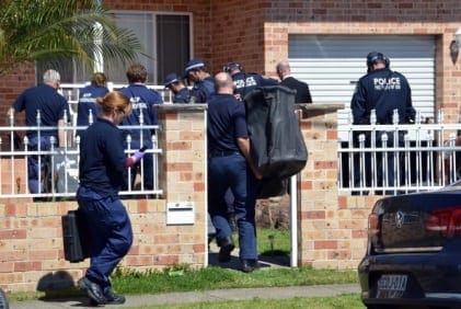 Forensic experts collect evidence from a house in the Guildford area of Sydney on September 18, 2014. Australia's largest ever counter-terrorism raids detained 15 people and disrupted plans to "commit violent acts", including against random members of the public that reportedly involved a beheading on camera. AFP PHOTO / Saeed Khan        (Photo credit should read SAEED KHAN/AFP/Getty Images)
