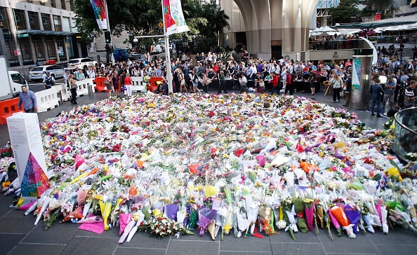 SYDNEY SIEGE MEMORIAL: Flowers are placed by people as a mark of respect for the victims of Martin Place siege. (Daniel Munoz/Getty Images)