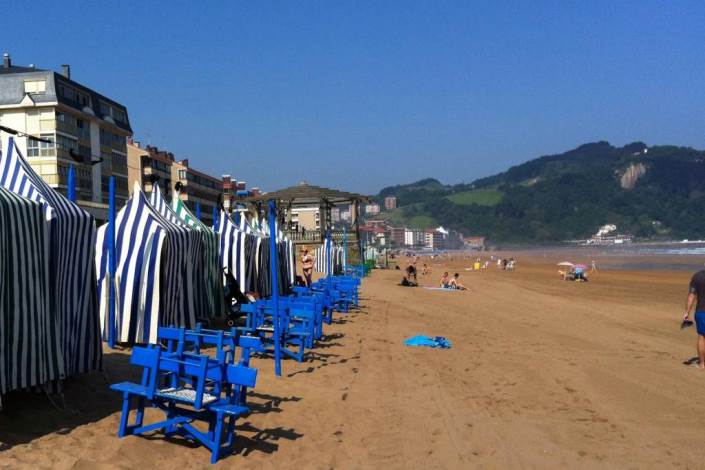 Blue-and-white-tents-on-the-beach-in-Zarautz-Spain