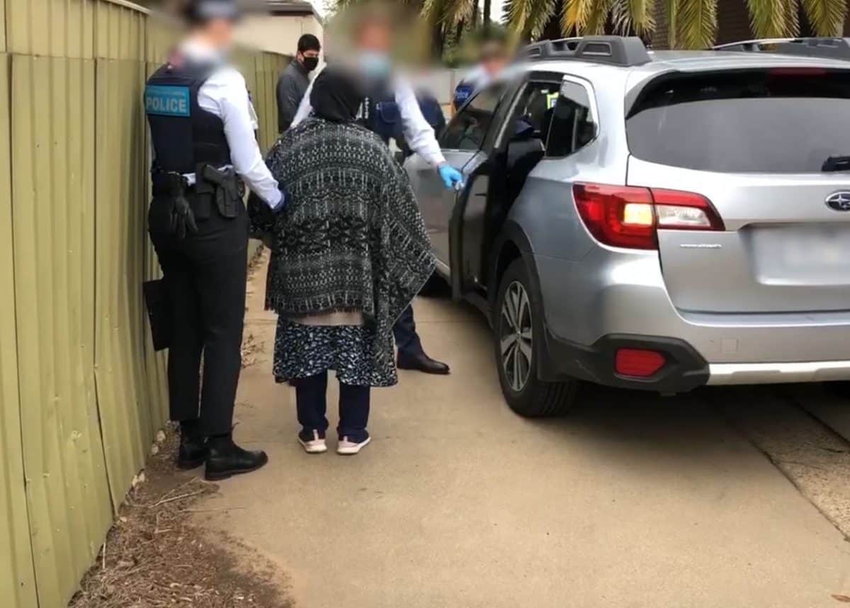 Alleged human traffickers being arrested in Shepparton. Photo credit: AFP