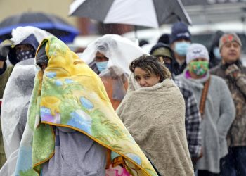 Waiting in line in freezing rain to fill propane tanks in Houston, Texas, Feb. 17, 2021. AP Photo/David J. Phillip