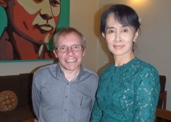 Professor Sean Turnell pictured with political leader and Nobel Peace Prize laurate, Aung San Suu Kyi. Photo credit: LinkedIn