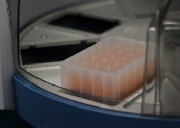 Sewage samples mixed with magnetic beads and loaded onto the liquid-handling robot for viral concentration. C. H. Sheikhzadeh @ HOMA Photographic Art