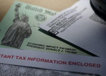 Most people used the first coronavirus check to pad their savings or pay down debt. AP Photo/Eric Gay