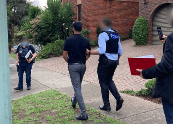 Federal Police make the Melbourne arrest. Photo credit: AFP