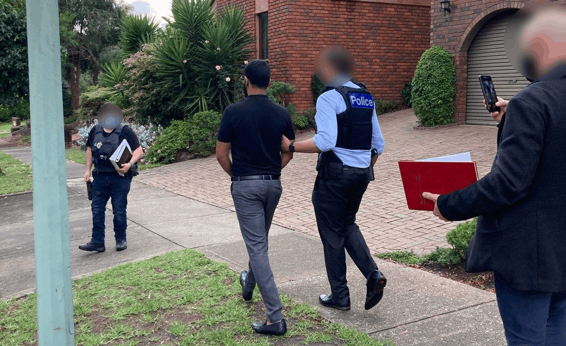 Federal Police make the Melbourne arrest. Photo credit: AFP