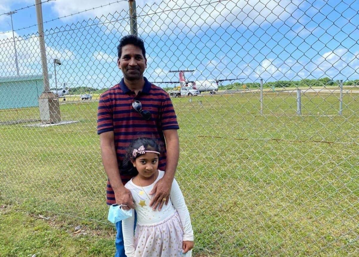 Nadesalingam Murugappan and his daughter Kopika about to board an aircraft to be reunited with the rest of the family in Perth. Photo via Nic Holas on Twitter