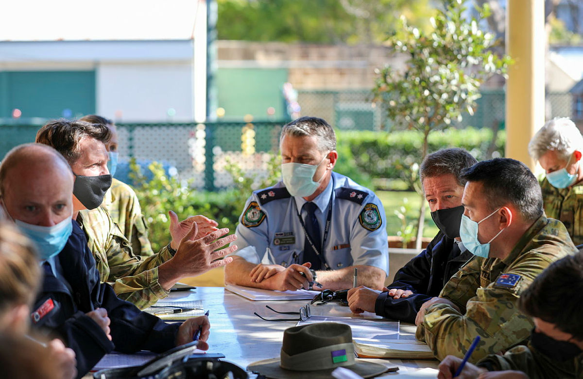 NSW Police Deputy Commissioner David Waddell and the ADF’s Colonel Warwick Young are joined by NSW Police and ADF representatives for a planning meeting in Sydney. Photo credit: ADF
