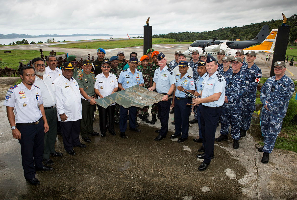 Director-General History and Heritage of the RAAF, Air Commodore John Meier, and Indonesian Chief of Staff of Air Force Operations Command in Biak, Marsma Erwin Buana Kaskoopsau III (centre front) hold a piece of tail wreckage from Catalina Flying Boat A24-50 which was salvaged during Operation Catalina Recovery. Photo credit: ADF