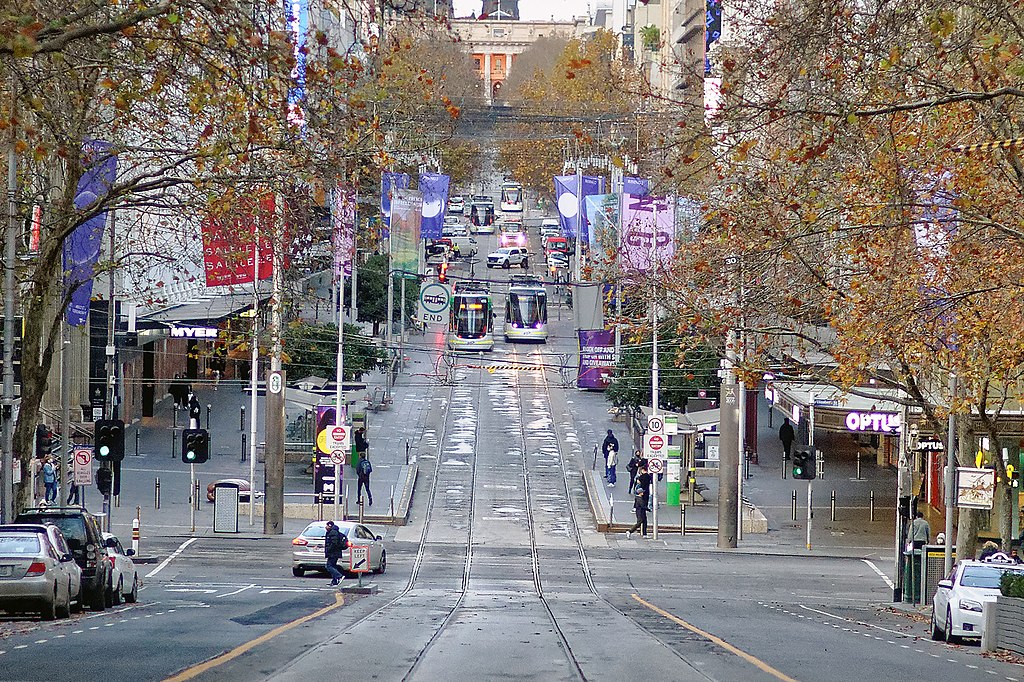 A near-deserted Melbourne CBD during lockdown. Photo credit: Michael J Fromholtz via Wikipedia