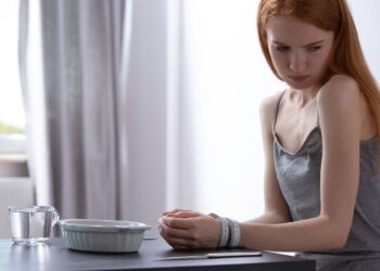 Why do many eating disorders start in adolescence?
